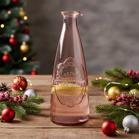 Clear glass bottle with vintage design on a wooden surface 